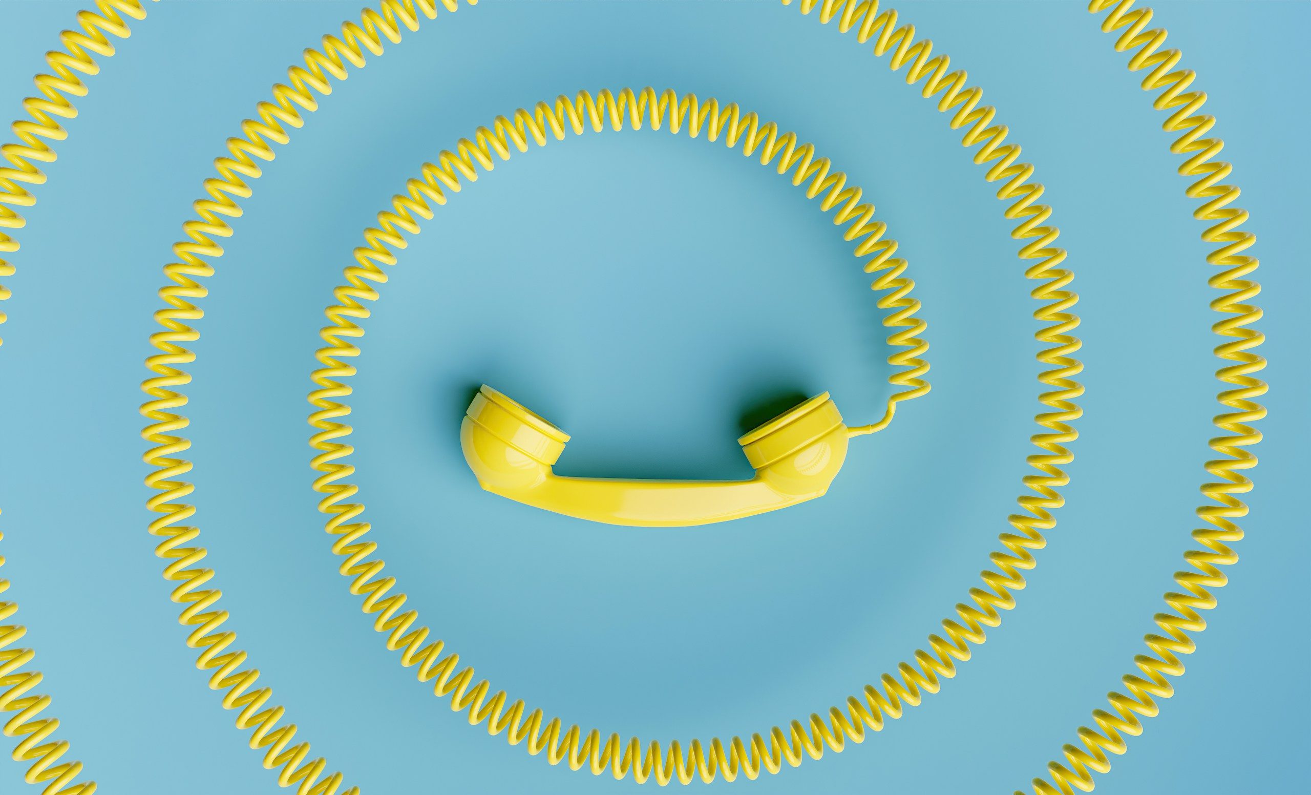 ein gelber Telefonhörer - der Kontakt zur Ergotherapie